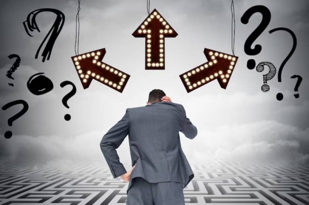 A man in a suit stands confused, facing three lit directional arrows surrounded by question marks, symbolizing decision-making.